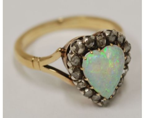 EARLY TWENTIETH CENTURY 18ct GOLD, OPAL AND DIAMOND CLUSTER RING, set with a heart shaped opal and surround of 15 small rose 