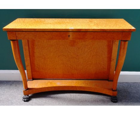 A Biedermeier style part ebonised bird's eye maple single drawer console, on turned supports and paw feet, 104cm wide x 81cm 