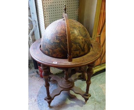 An early 20th century drinks cabinet formed as a globe, 67cm wide x 100cm high. 