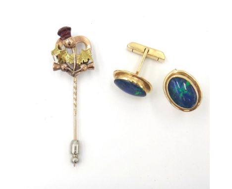 A pair of gold mounted oval opal triplet set cufflinks, each front collet set with an oval opal triplet, the backs with foldi