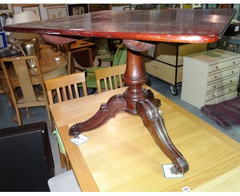 A 19th century mahogany centre table on tripod base, 91cm wide  x 73 cm high. 