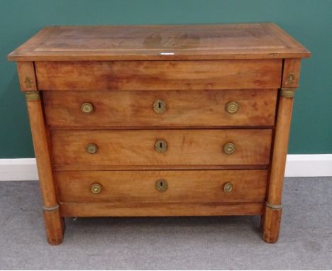  A 19th century French gilt metal mounted walnut and fruitwood commode with four long drawers flanked by turned columns, 119c