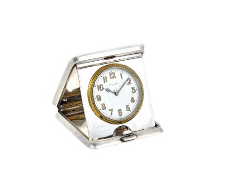 A Mappin & Webb silver rectangular cased, keyless wind travelling clock, the circular enamelled dial with Arabic numerals and