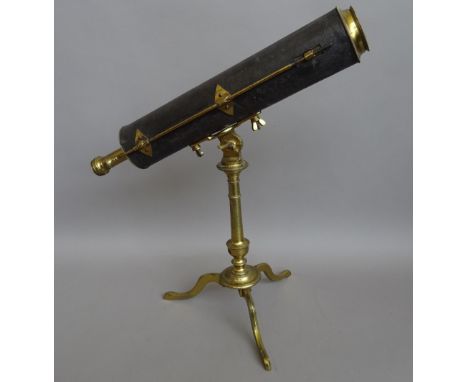 A 2-inch brass reflecting telescope on stand, English late 18th century, the leather bound tube with focusing to the secondar