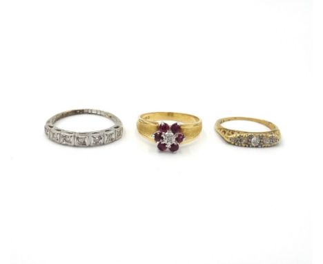 A gold and diamond set five stone ring, mounted with a row of cushion shaped diamonds, an 18ct gold, ruby and diamond set sev