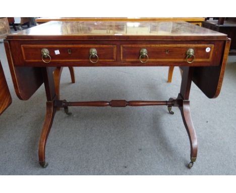 A Regency satinwood banded mahogany two drawer sofa table on four downswept supports, 95cm across x 152cm across open x 75cm 