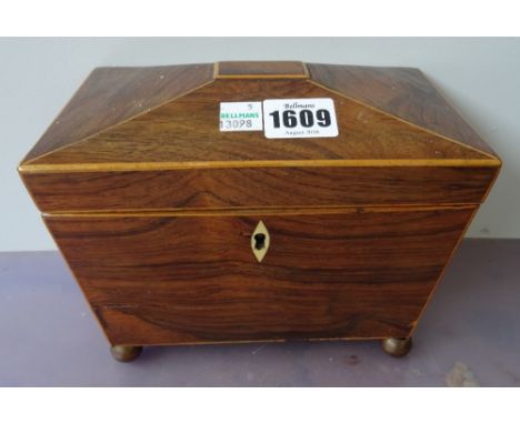 A Regency rosewood sarcophagus tea caddy on gilt ball supports, 20cm wide x 15cm high x 12cm deep.  