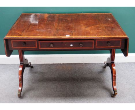 A Regency crossbanded rosewood sofa table, with three frieze drawers and dummy opposing on four downswept supports, 115cm cro