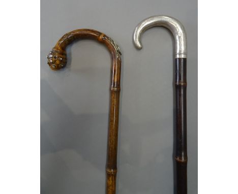 A bamboo and silver mounted 'horse measure' walking stick, 19th century, stamped 'ARNOLD & SONS LONDON' (93cm) and another si