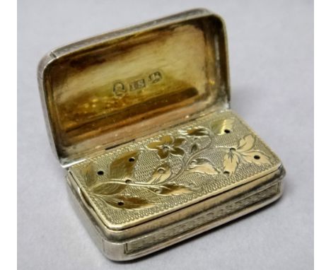 A George III silver rectangular vinaigrette, with a gilt floral and foliate pierced grille, the exterior engine turned, Birmi