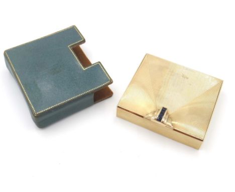 A Tiffany & Co gold and sapphire set lady's rectangular powder compact, fitted with a mirror within, the exterior with banded