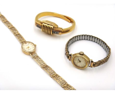 An Accurist Gold 9ct gold lady's bracelet wristwatch, the signed oval cream coloured dial with gilt baton numerals, the 9ct g