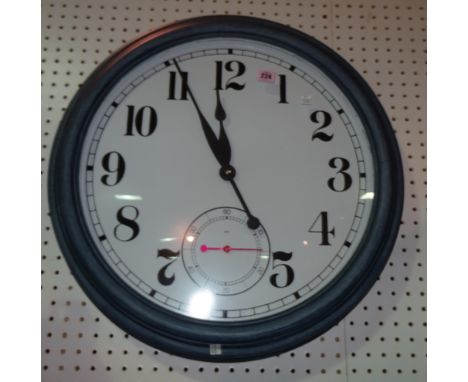 A large 20th century blue painted circular wall clock with quartz movement, 50cm wide. 