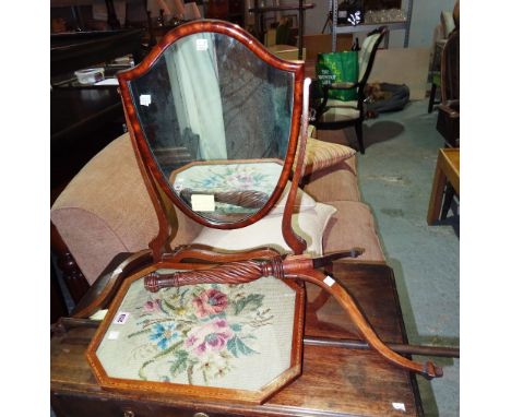A Regency mahogany pole screen on tripod base, (a.f), and a shield shape mahogany toilet mirror, 40cm wide (2).