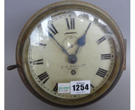 An Irish gilt metal cased 'port hole' wall clock, with slow/fast adjustment and subsidiary seconds dial, detailed 'S.P Neill 