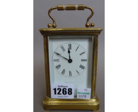 A late 19th century brass cased carriage clock, the white enamel dial detailed 'HAMILTON & CO CALCUTTA MADE IN FRANCE', prese