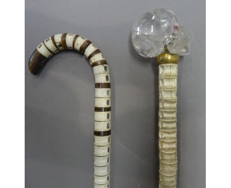 A Victorian shark vertebrae walking stick with horn inclusions (88cm) and a modern shark vertebrae walking cane with a carved