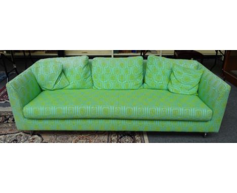 DESIGNERS GUILD FURNITURE; a 20th century twin tone green upholstered square back sofa, on chrome supports, 213cm wide x 67cm