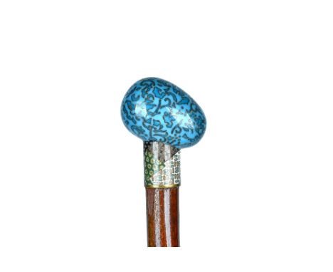 A cloisonné enamel hardwood walking cane, circa 1900, with egg form pommel (89cm) and one further walking cane, with cloisonn