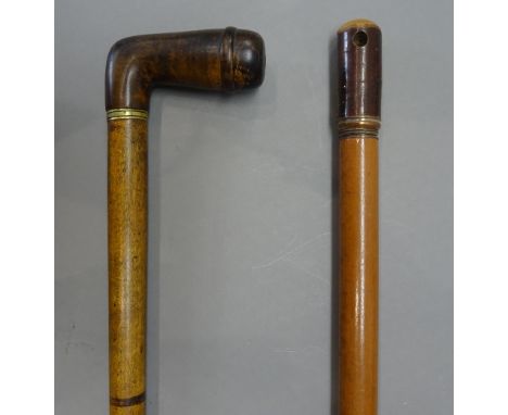 A carved wooden 'pipe' gadget walking stick, early 20th century, with pipe bowl handle and a concealed mouthpiece (87cm) and 