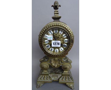 A Louis XIV style brass mantel clock, circa 1900, the two train movement stamped 'MILLER & SONS' (36cm high) and a Japanned m