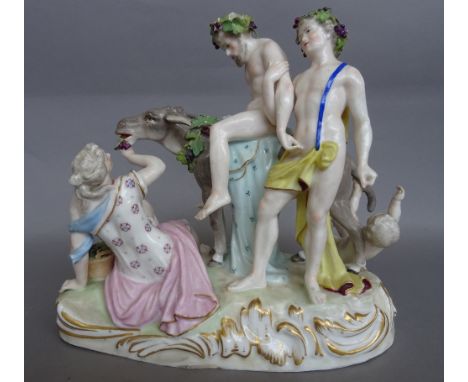 A Paris porcelain group of drunken Silenus, late 19th century, after a Meissen original, modelled seated on the back of a don