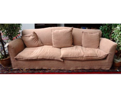 Conran; a 20th century sofa with loose tan cotton covers, 225cm wide x 85cm high.