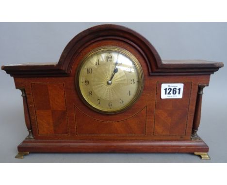 An Edwardian mahogany and inlaid dome top mantel clock with engine turned dial, flanked by pillared supports (31.5cm), a repr