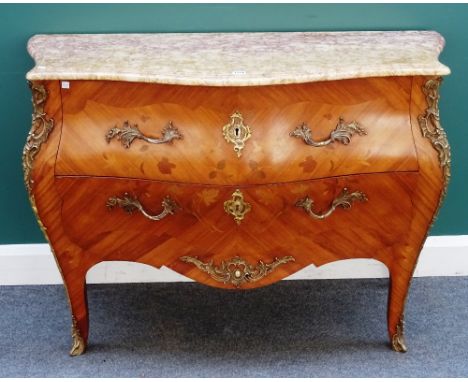 A Louis XV style commode, the serpentine marble top over a gilt metal mounted floral marquetry inlaid kingwood bombé two draw