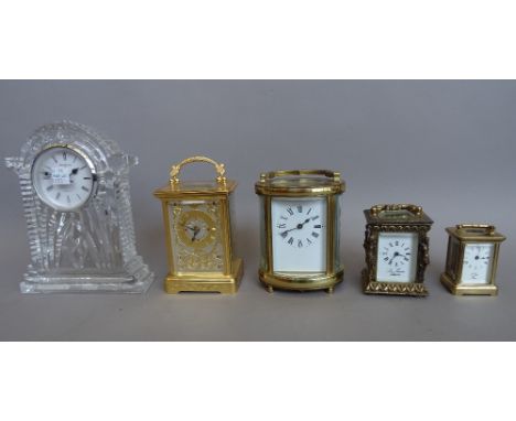 A French 'L Epee' miniature brass cased carriage clock (11cm high, key), a brass cased carriage clock of oval form (11.5cm hi