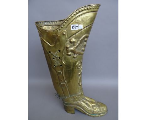 A French brass embossed stick stand, 20th century, modelled as a military officer's boot, 60cm high. 