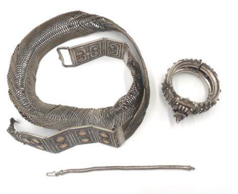 Tribal wares, comprising; a waist belt of serpentine wirework form, the front decorated in filigree with red and blue synthet