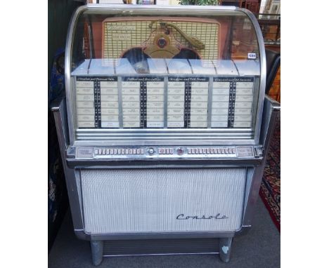 A Wurlitzer console jukebox, multi-selector phonograph circa 1958, model 2204, (a.f) 135cm high x 92cm wide x 69cm deep. Illu