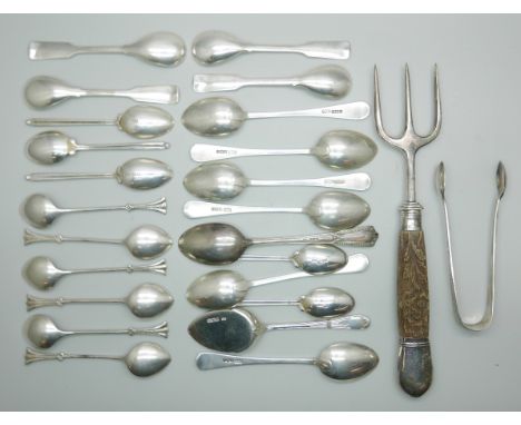 A collection of silver spoons, 239g, a silver mounted toasting fork and ten plated spoons