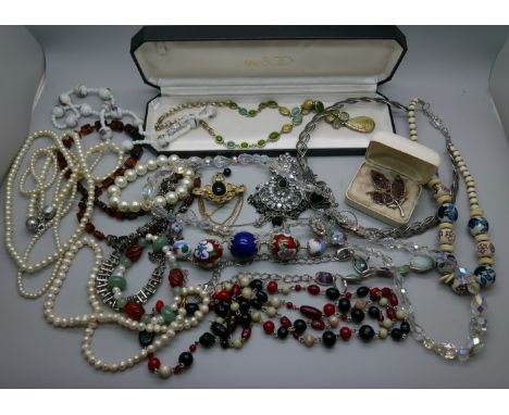 A collection of vintage and modern costume jewellery including Celtic style choker, Victorian style paste set pendant, stone 