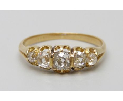 A Victorian yellow metal ring set with five old cut diamonds, 1.9g, J/K