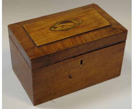A Victorian mahogany sarcophagus tea caddy, inlaid shell shaped patera to top