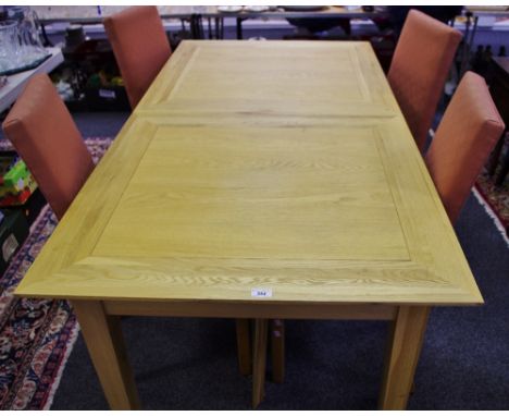 A contemporary light oak extending dining table and four upholstered chairs. (5)