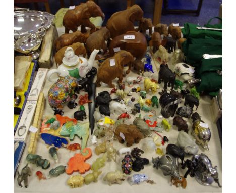 A substantial quantity of model elephants including a chrome car/truck mascot; others including hardwood, glass, jade example