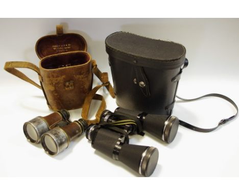 Militaria - a pair of WWI binoculars, original case, stamped with broad arrow; another larger modern pair, cased (2)