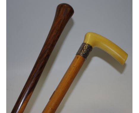 Walking sticks - a Victorian malacca shafted ivorine walking stick with silver collar; another cane (2)