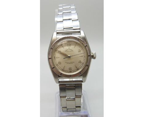 A 1959 Rolex Oyster 'Bubbleback' Perpetual Chronometer stainless steel wristwatch on a riveted stainless steel Oyster bracele