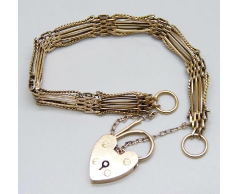 An 18ct gold gate bracelet with fancy rope design links and padlock clasp, 18.3g, 9mm link width
