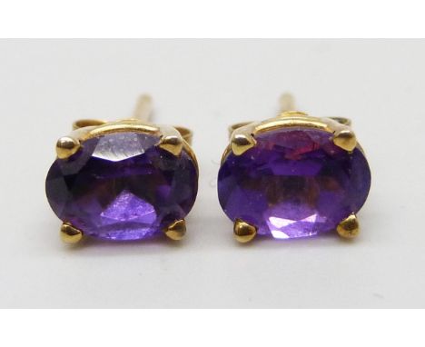 A pair of 9ct gold amethyst set stud earrings, 1.3g