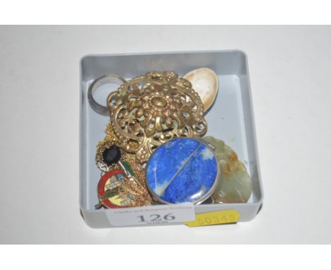 A yellow metal filigree pendant; a carved jade pendant; a small circular pill box; and various other jewellery etc.