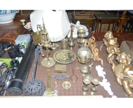 A quantity of brassware to include an Eastern oil lamp; vases; horse brasses; a table lamp etc