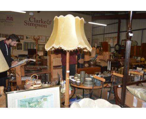 A mahogany standard lamp and shade 