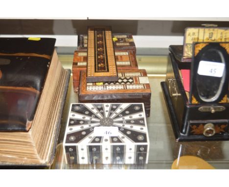 Four various cribbage boards; and a Vizagapatum box 