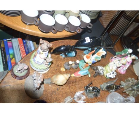 A quantity of glass ornaments and paperweights; a Royal Worcester figurine entitled "My Favourite" AF; two Poole pottery dolp