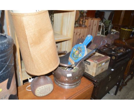 A copper coal scuttle; a chestnut roaster; a pair of bellows and a pottery table lamp and shade